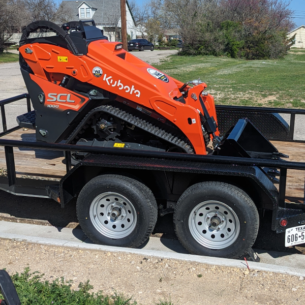 Wired Equipment - (940) 202-8413 - Kubota SCL1000 - Right Center Profile Loaded on the Trailer