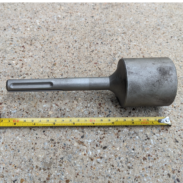 Demo Hammer Bit - Bell - laying down - Wired Equipment Inc - (940) 202-8413